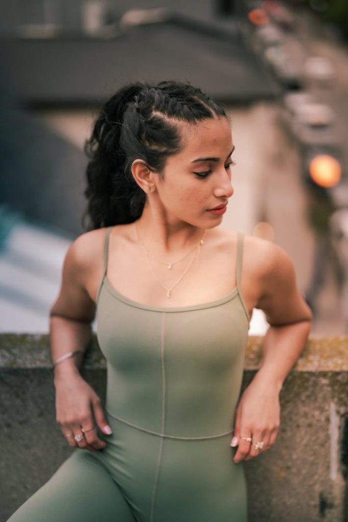 woman-in-green-outfit-relaxing-outdoors-29538792